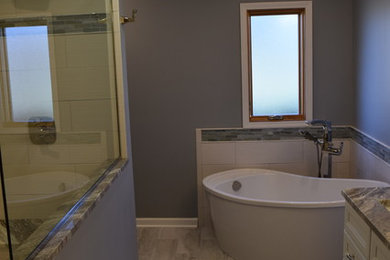 Mid-sized master gray tile and ceramic tile ceramic tile bathroom photo in Chicago with flat-panel cabinets, white cabinets, a two-piece toilet, gray walls, an undermount sink and granite countertops