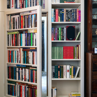 Photo of a mid-sized traditional home office in Wiltshire with a library, beige walls, limestone floors, a freestanding desk and grey floor.