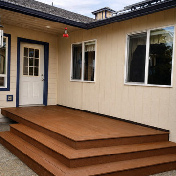 Brown Composite Back Door Deck with Surrounding Steps in Oakville, WA