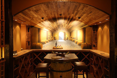 Wine cellar - rustic wine cellar idea in Denver