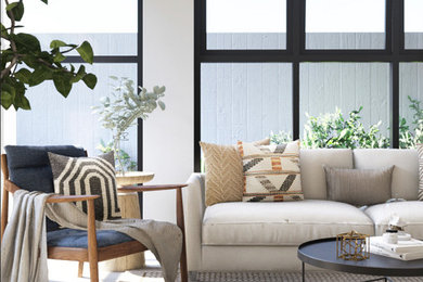 Mid-sized 1960s open concept porcelain tile and gray floor living room photo in Other with white walls