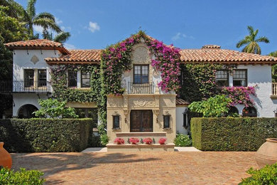 Inspiration for a mediterranean two-story exterior home remodel in Miami