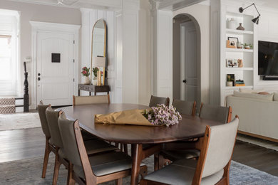 Dining room - transitional brown floor dining room idea in San Diego with beige walls, a standard fireplace and a stone fireplace