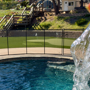Resort-Style Pool Waterfall with Backyard Putting Green | Nisleit Residence, Pow