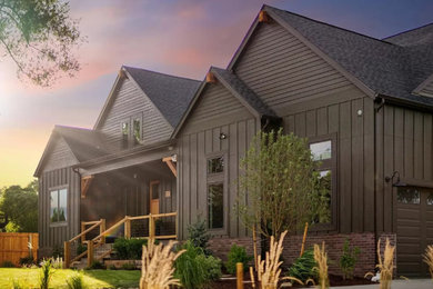 Example of a large transitional green one-story mixed siding and board and batten exterior home design in Denver with a shingle roof and a gray roof