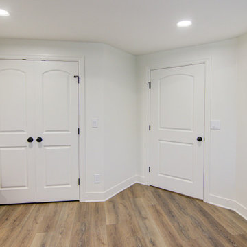 Warm & Inviting Basement Retreat with Kitchenette and Reading Nook