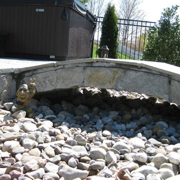 stone bridge over dry stream bed