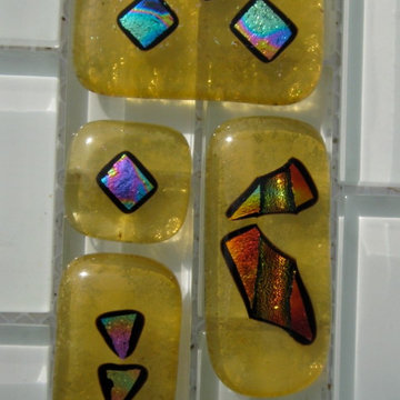 Fused glass tiles in your choice of base color feature dichroic accents and can