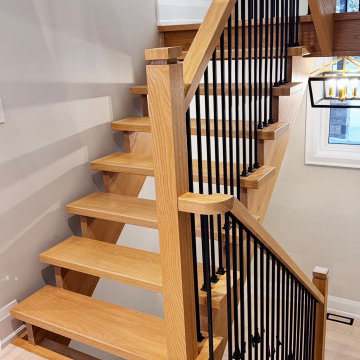 Modern White Oak Open Riser Staircase with Black Metal Balusters
