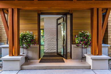 Inspiration for a contemporary front door in Vancouver with a pivot front door and a glass front door.