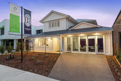 This is an example of a beach style home design in Melbourne.