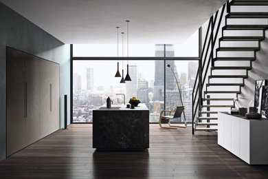 Inspiration for a medium sized modern open plan kitchen in Other with integrated appliances, porcelain flooring, an island, brown floors and black worktops.