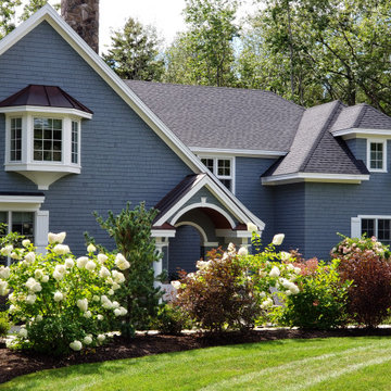 An extensive landscape project with stonewalls, patio, dry river bed & more