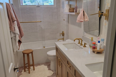 Inspiration for a mid-sized rustic kids' porcelain tile, pink floor and double-sink bathroom remodel in San Francisco with shaker cabinets, light wood cabinets, a two-piece toilet, white walls, an undermount sink, quartzite countertops, white countertops and a built-in vanity