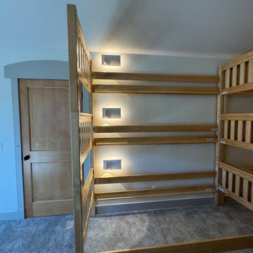 Upper level loft bunk room, phone chargers with lights, ceiling fans,