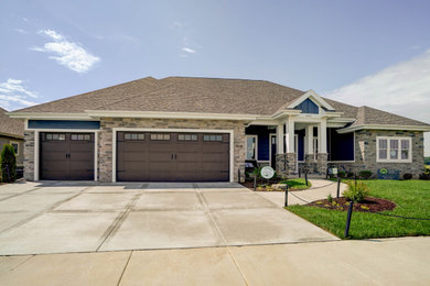 Large minimalist blue one-story exterior home photo in Other with a shingle roof