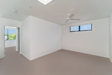Photo of a mid-sized modern home design in Gold Coast - Tweed.