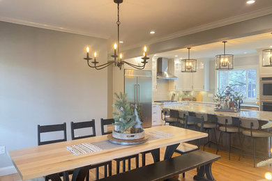 Example of a large cottage light wood floor great room design in Bridgeport with gray walls