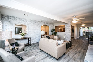 Living room - large traditional formal and open concept ceramic tile and gray floor living room idea in Phoenix with gray walls and a media wall