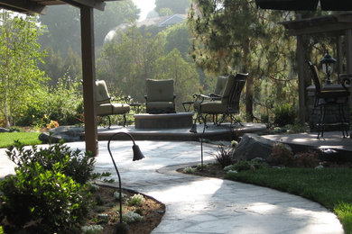 Inspiration for a large backyard landscaping in Orange County.