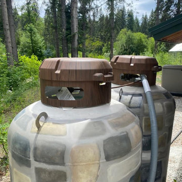 Commissioned Propane Tanks Disguise to match house rocks