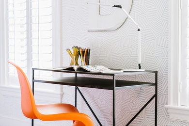 Example of a trendy gender-neutral carpeted kids' study room design in Other with multicolored walls