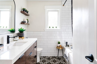 Bathroom - small eclectic 3/4 white tile and porcelain tile porcelain tile, multicolored floor and single-sink bathroom idea in Vancouver with flat-panel cabinets, brown cabinets, a one-piece toilet, gray walls, an undermount sink, quartz countertops, multicolored countertops and a built-in vanity