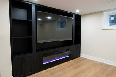 Minimalist family room photo in Toronto