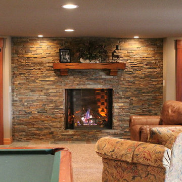 Eye-popping Denver Basement Remodel with hidden bookcase doors and tray ceilings