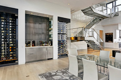 Inspiration for a large contemporary light wood floor great room remodel in Houston with white walls and no fireplace