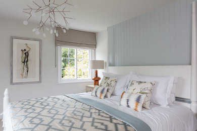 Mid-sized contemporary bedroom in Sussex with white walls and no fireplace.