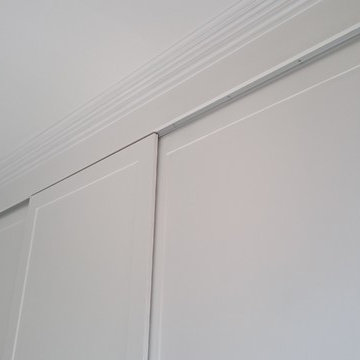 Wardrobes with sliding doors.
