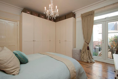 This is an example of a country bedroom in Sussex.