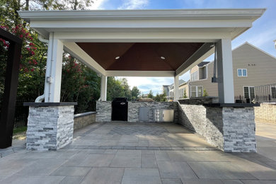 Inspiration for a concrete paver porch remodel in DC Metro