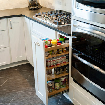Functional spice pullout in white shaker cabinets