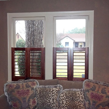 Stained Shutters on White Casement Windows