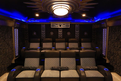Photo of a large modern enclosed home theatre in Seattle with multi-coloured walls.