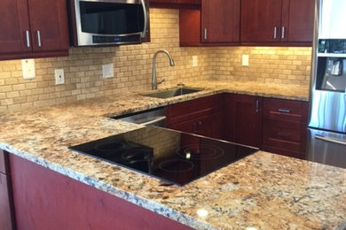 Inspiration for a mid-sized timeless u-shaped laminate floor open concept kitchen remodel in Hawaii with a single-bowl sink, shaker cabinets, dark wood cabinets, granite countertops, beige backsplash, subway tile backsplash, stainless steel appliances and a peninsula
