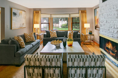 Large transitional enclosed living room photo in New York with a stone fireplace