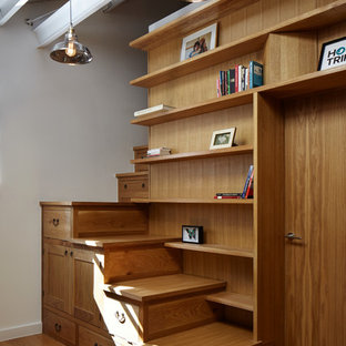 This is an example of a small industrial wood l-shaped staircase in London with wood risers.