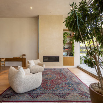Warm Minimal Living Room with Fireplace and Natural Light
