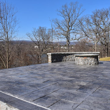 Stamped Concrete with Stone fire pit and stone wall