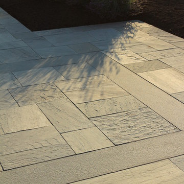 Bluestone Terraces, Porches, walkway and Plantings By Garden Artisans LLC
