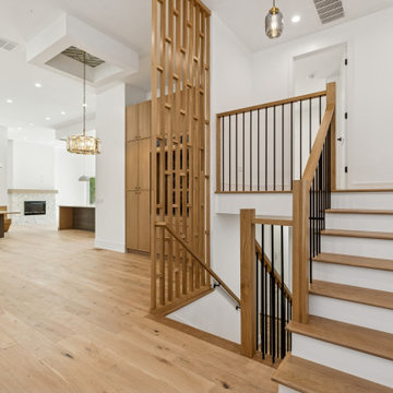 Sculptural Staircase with Vertical Slat Screen & Oak Flooring