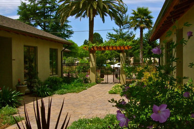 Design ideas for a mid-sized mediterranean partial sun courtyard concrete paver garden path in San Francisco for summer.