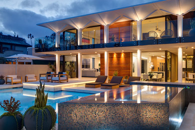 Hot tub - contemporary backyard tile and custom-shaped lap hot tub idea in San Diego