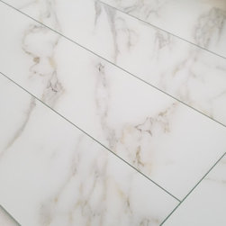 Abolos - Nature 4 in x 16 in Glass Subway Tile in Calacatta Gold - Mosaic Tile