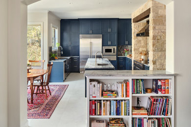 Example of a transitional u-shaped porcelain tile and beige floor eat-in kitchen design in Austin with an undermount sink, shaker cabinets, blue cabinets, quartzite countertops, stone slab backsplash, stainless steel appliances, an island, gray backsplash and gray countertops