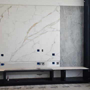 Custom Built-In Modern Entertainment Center with Wood Slatted Wall and Fireplace