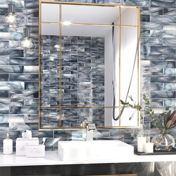 Marbled Glass Tile Bathroom With Brass Mirror